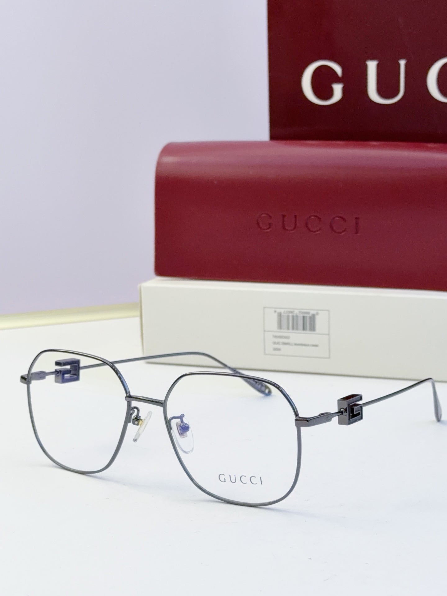 Round metal eyeglasses with dark frame and clear lenses