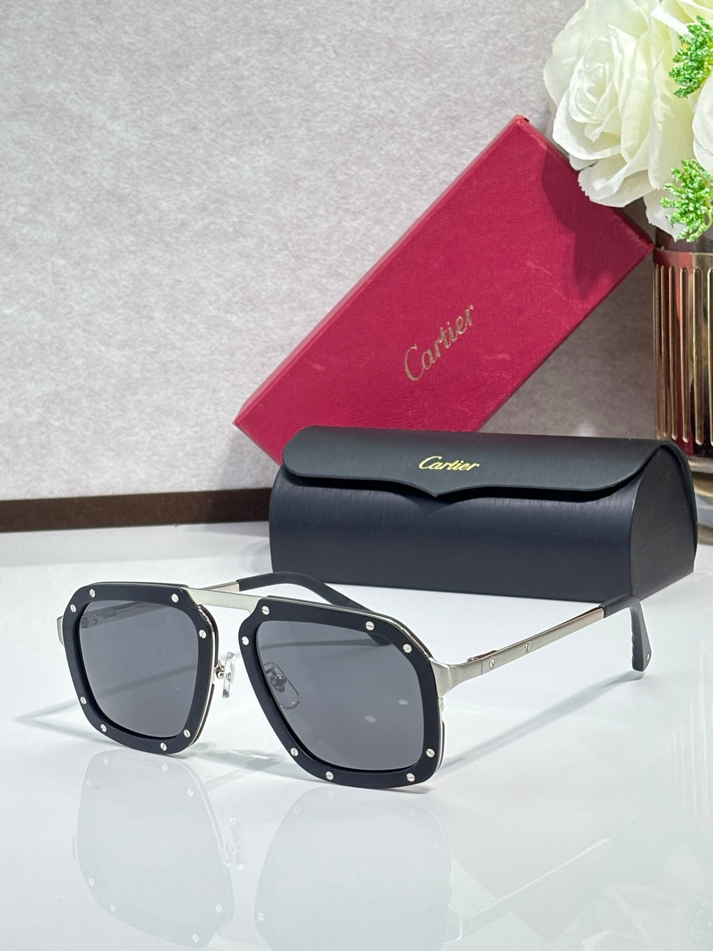 Square black acetate sunglasses with dark blue lenses and gold-tone temples