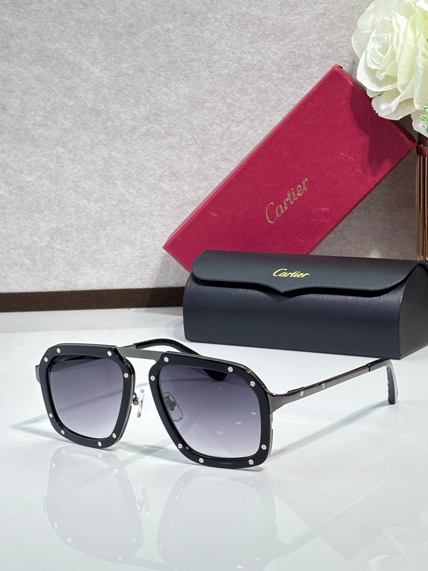 Square black acetate sunglasses with dark blue lenses, gold-tone temples