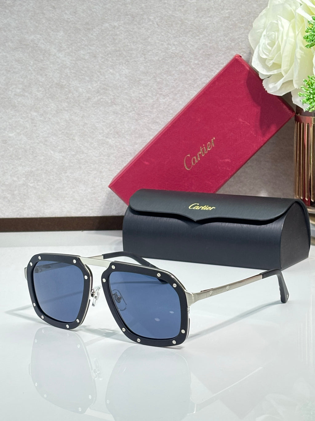 Square black acetate sunglasses with dark blue lenses and gold-tone temples