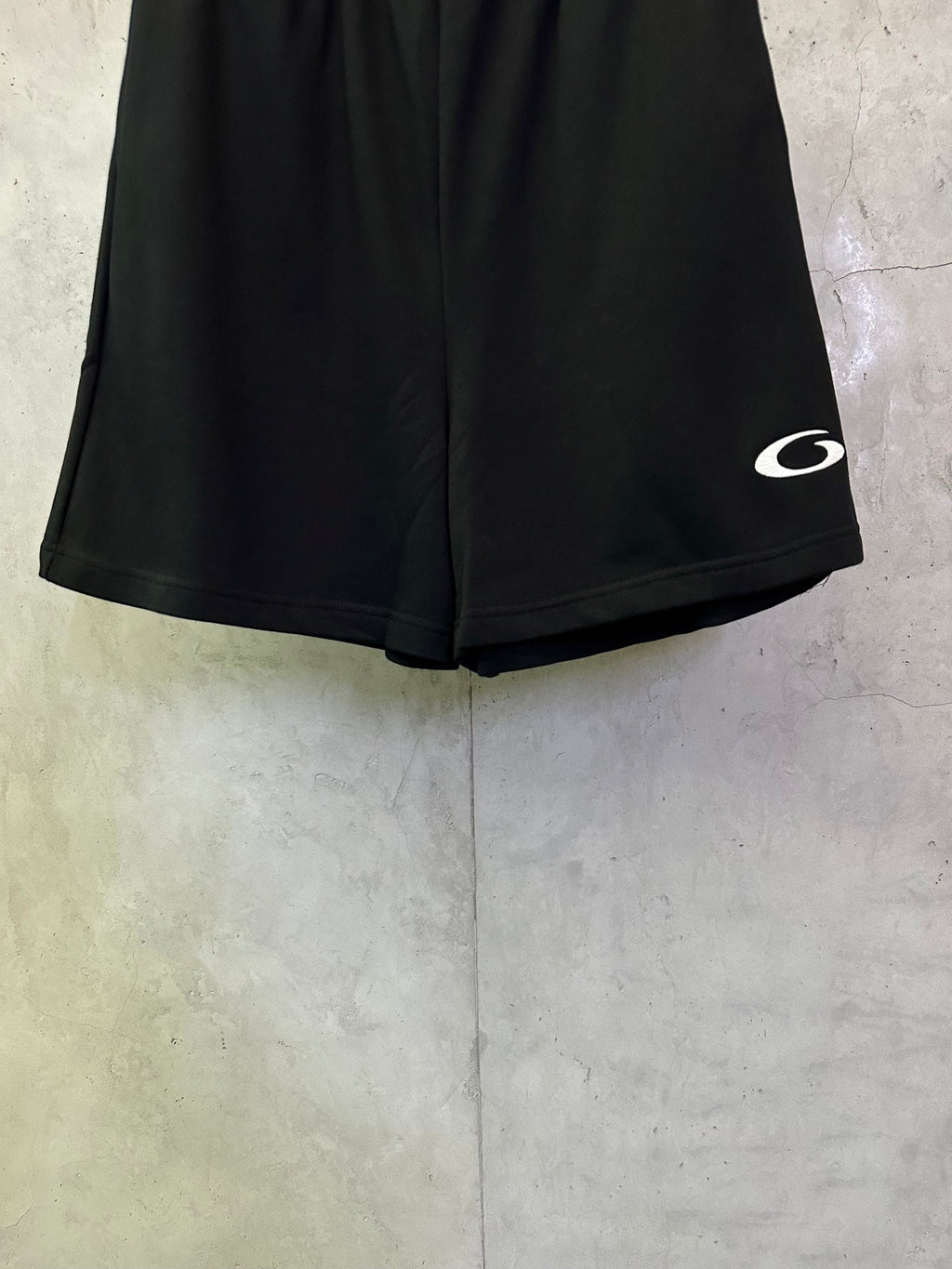 Balenciaga shorts, dark black, with white logo detail on the side