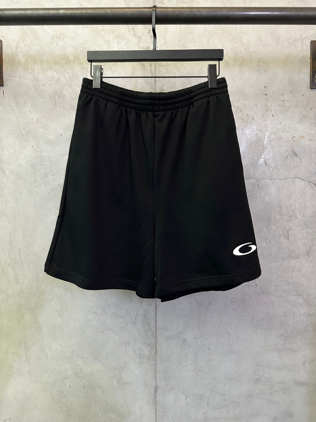 Balenciaga shorts in dark black with elastic waistband and small white logo on side