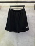 Balenciaga shorts in dark black with elastic waistband and small white logo on side