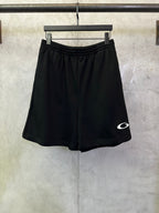 Balenciaga shorts in dark black with elastic waistband and small white logo on side