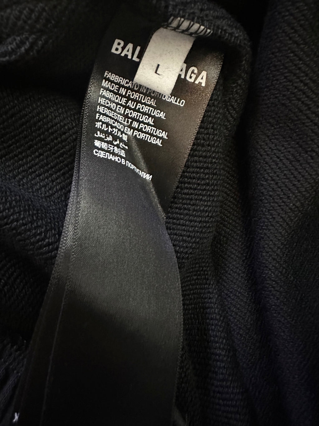 Balenciaga shorts fabric label tag showing brand text and size details