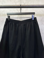 Balenciaga shorts with elastic waistband and pleated front in dark black