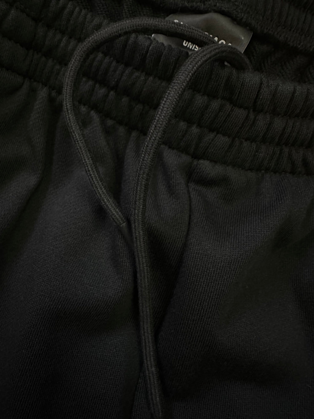 Balenciaga shorts waistband close-up with drawstring and ribbed elastic