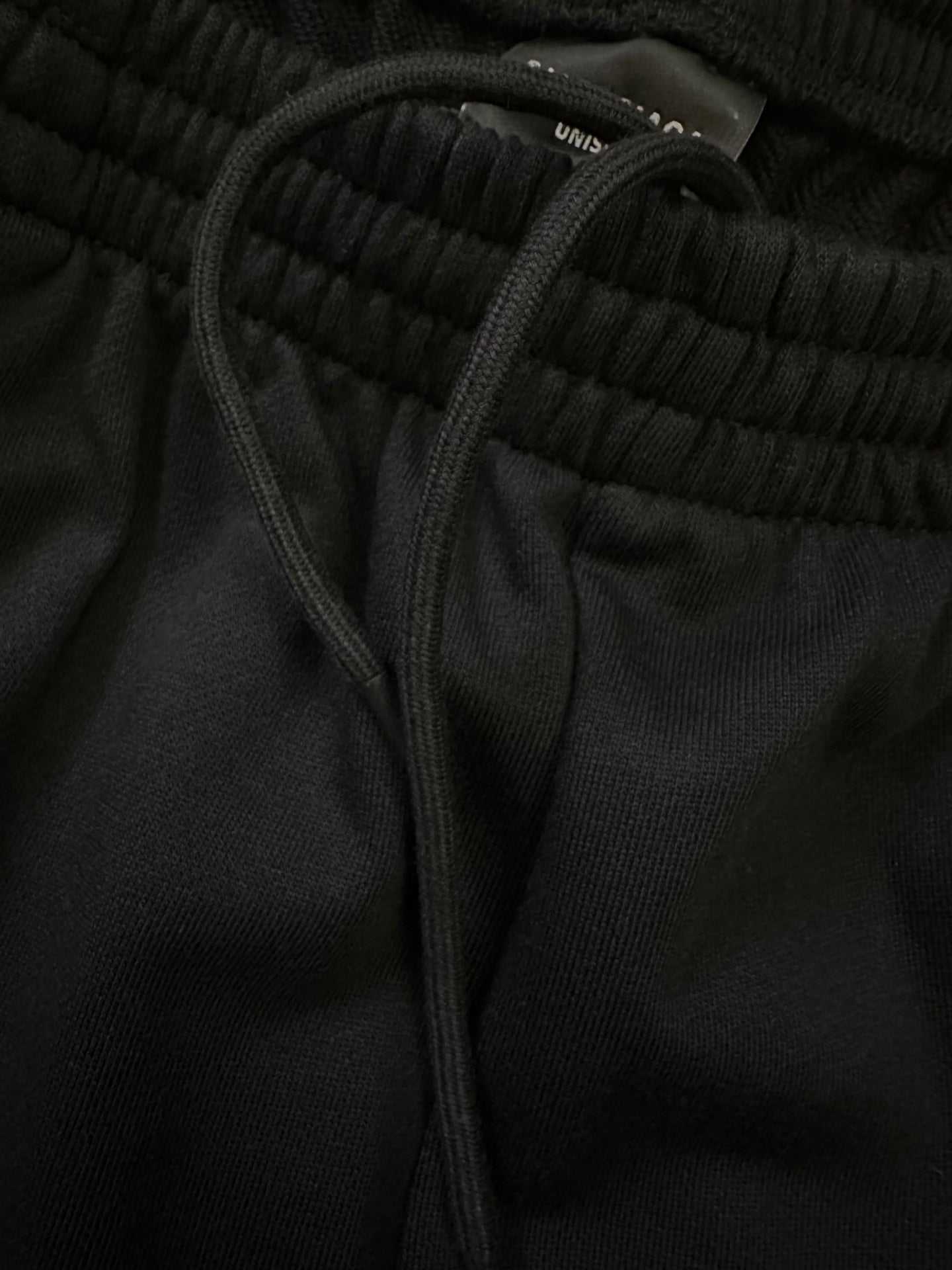Balenciaga shorts waistband close-up with drawstring and ribbed elastic