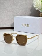 Dior sunglasses with brown-tinted lenses and gold-tone oversized square frames