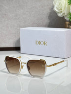 Dior sunglasses with brown-tinted lenses and white-trimmed gold-tone square frames