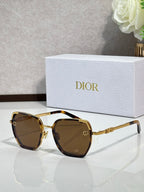 Dior sunglasses with brown-tinted lenses and gold-tone oversized square frames