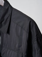 Prada dark short jacket shoulder and sleeve seam detail