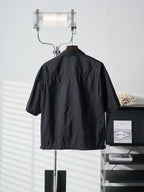 Prada dark short jacket back view with high stand collar
