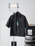 Prada dark short jacket with front zipper and chest pockets