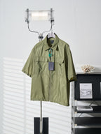Olive green Prada short-sleeve jacket with stand collar and chest flap pockets