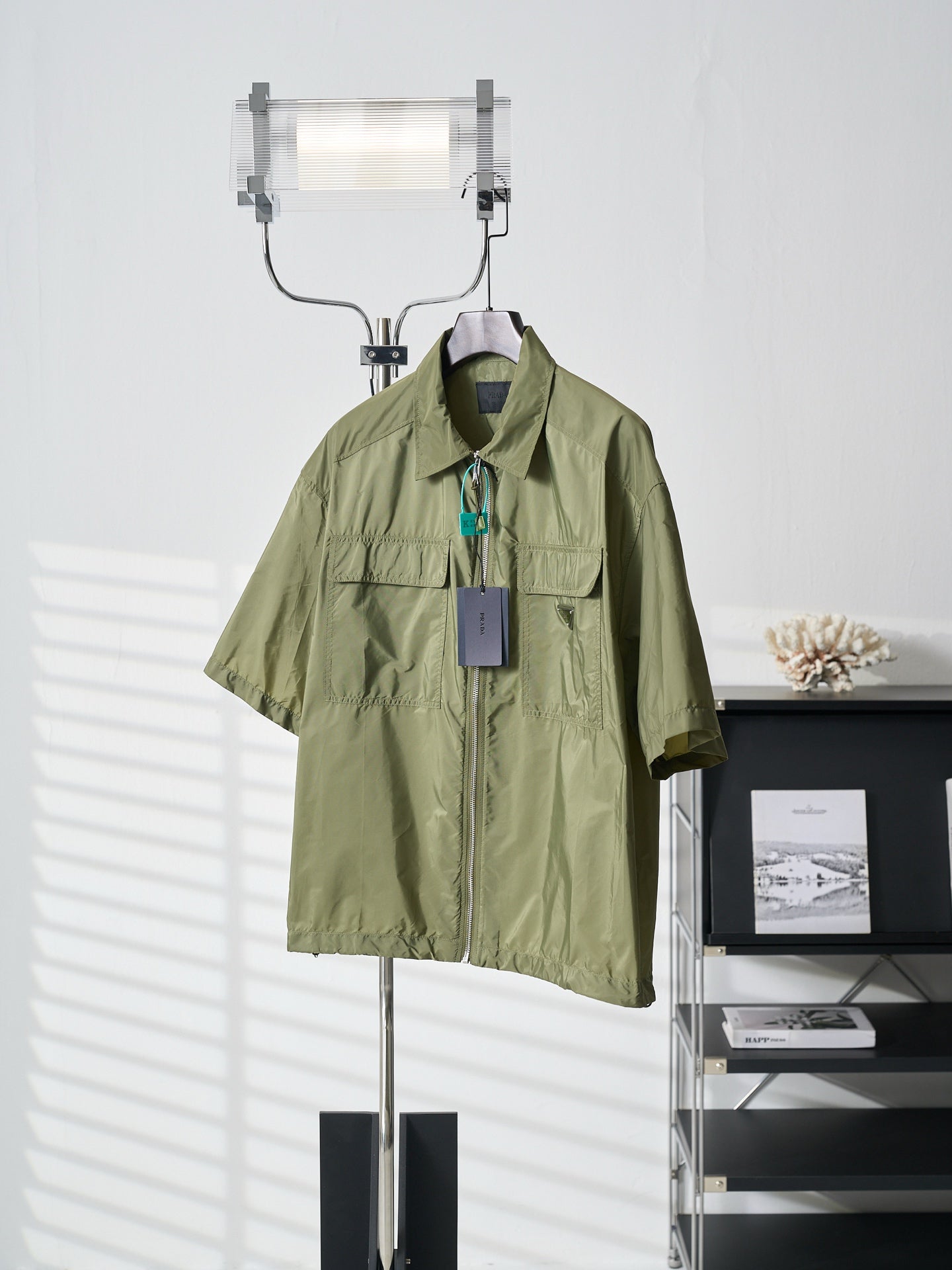 Olive green Prada short-sleeve jacket with stand collar and chest flap pockets