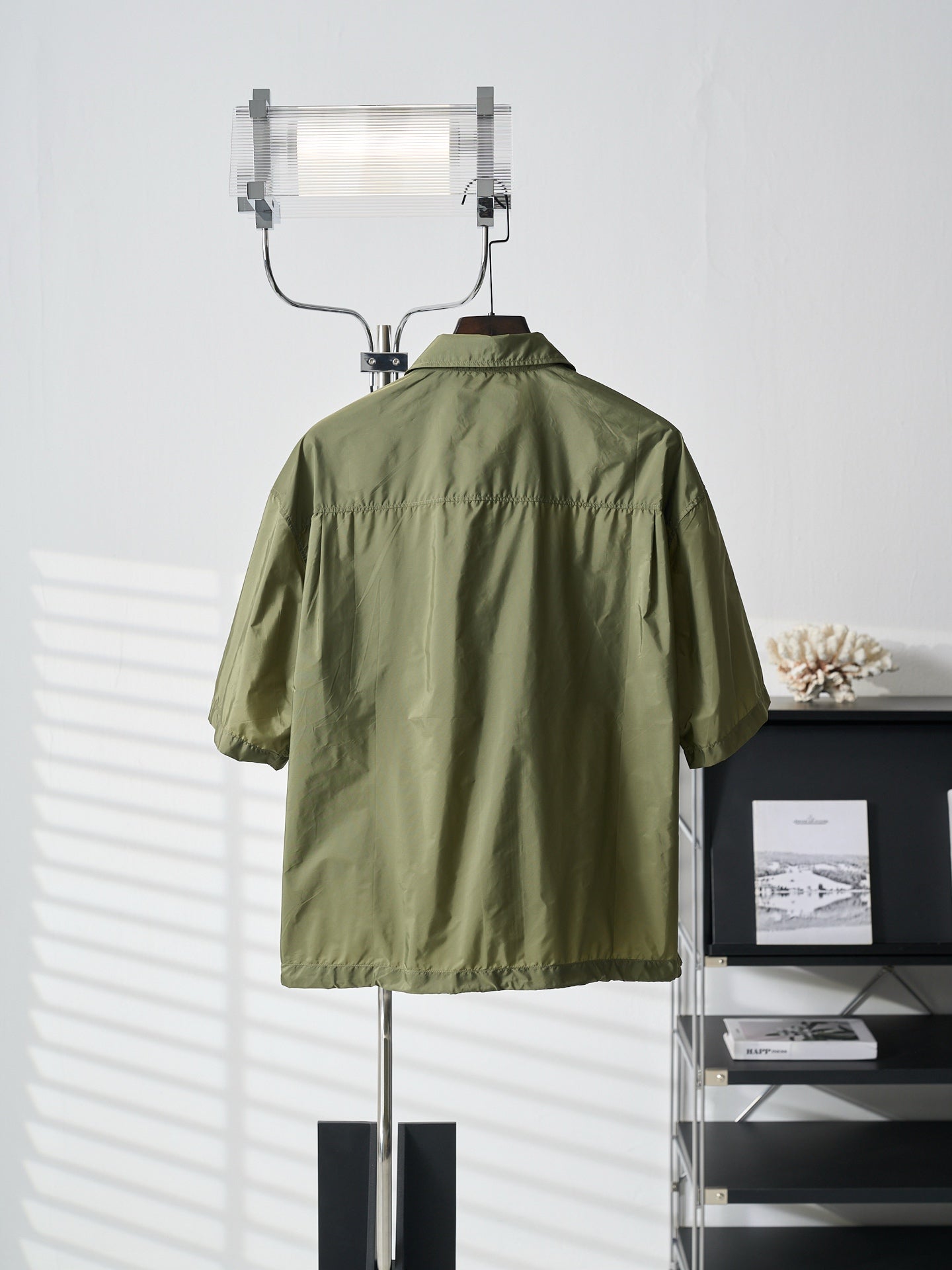Olive green Prada short-sleeve jacket back view with stand collar and yoke seam