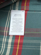 Inside label on teal plaid button-up shirt showing Made in Vietnam
