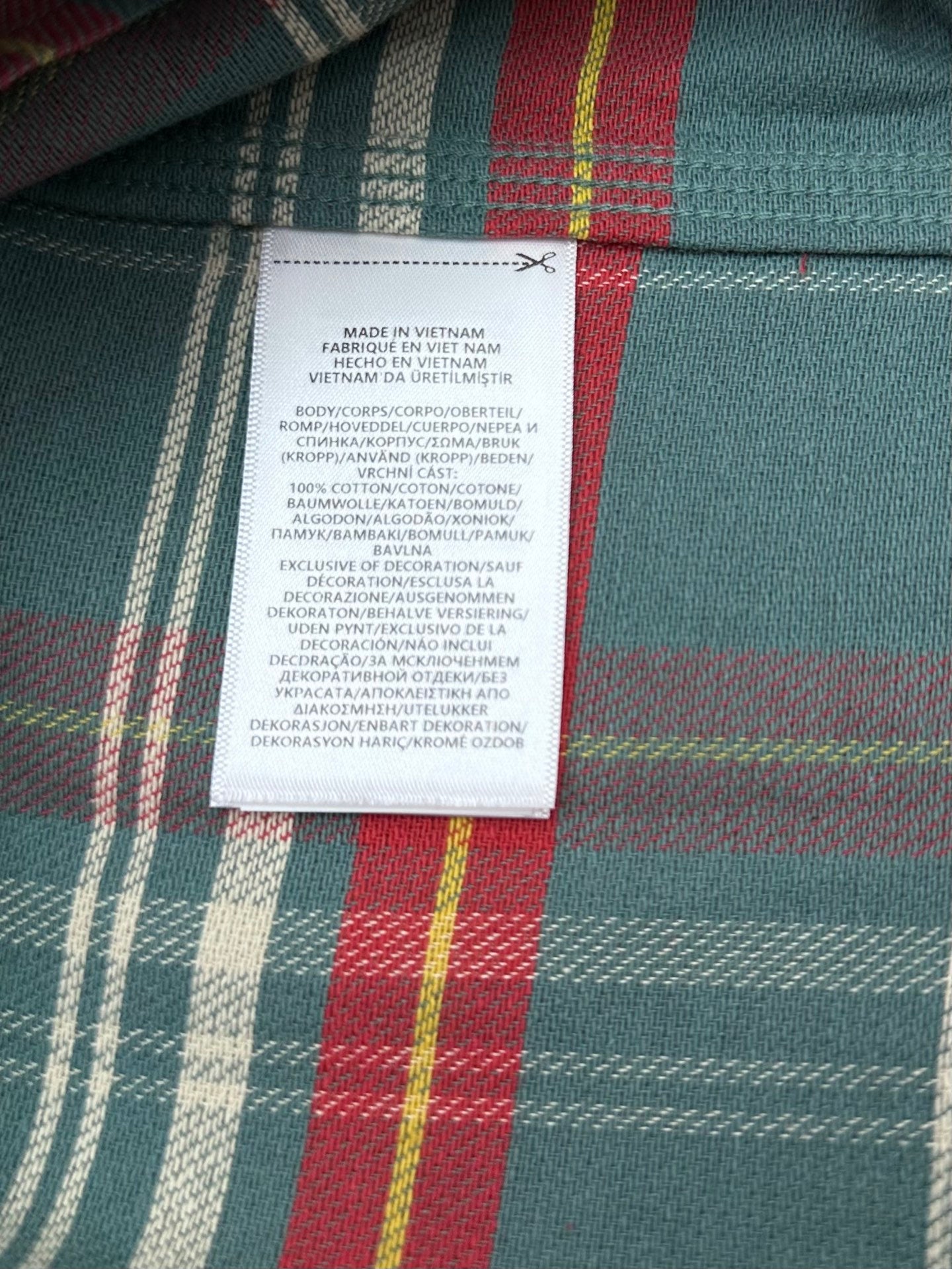 Inside label on teal plaid button-up shirt showing Made in Vietnam