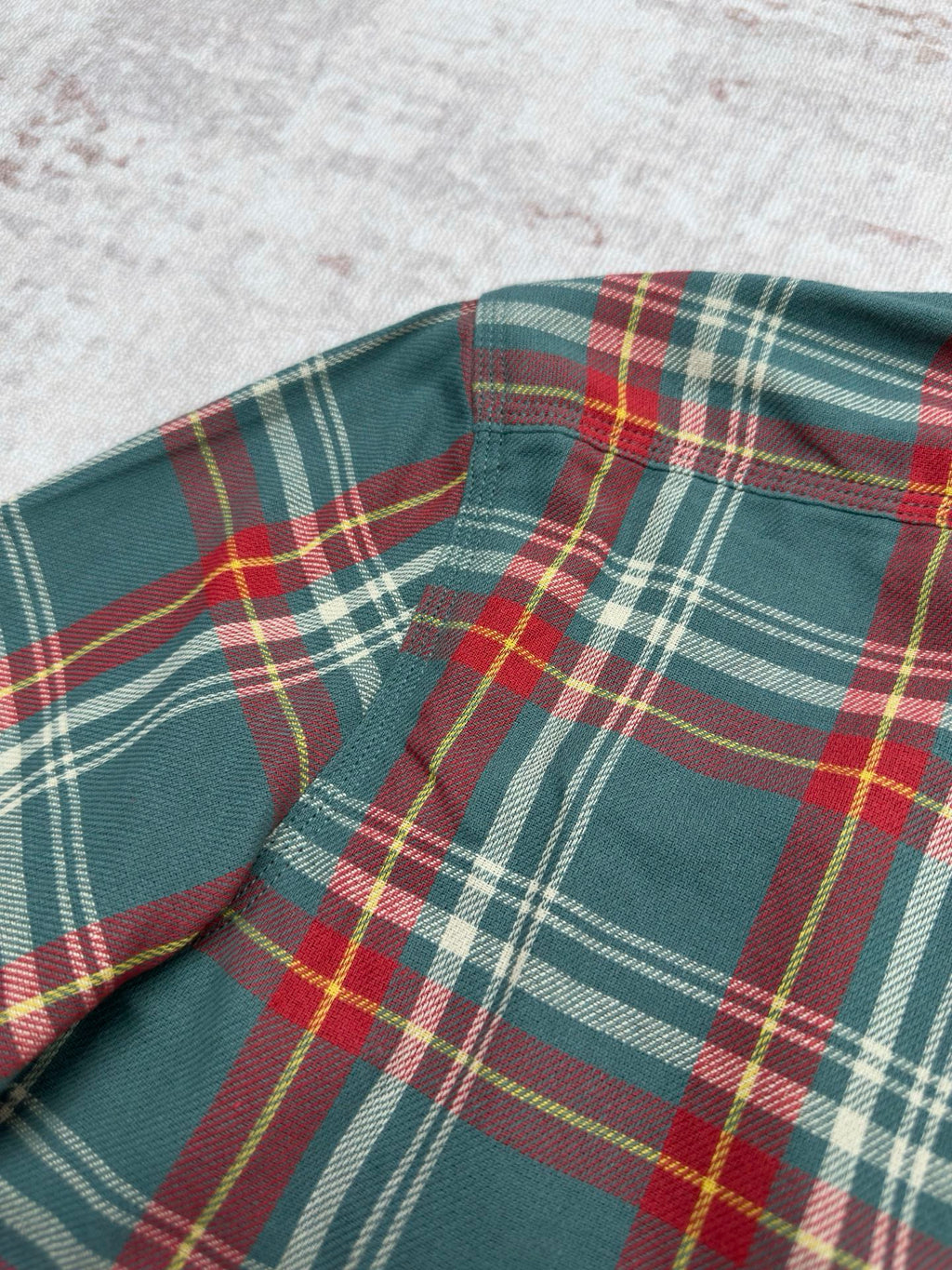 Ralph Lauren plaid shirt shoulder and collar area in teal, red, yellow, and white