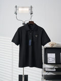 Black Prada polo shirt with short sleeves and button placket on hanger