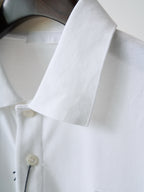 White polo shirt collar and sleeve cuff with button detail