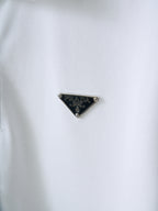 PRADA triangle logo on white polo shirt fabric