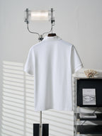 White short-sleeve polo shirt, back view on hanger