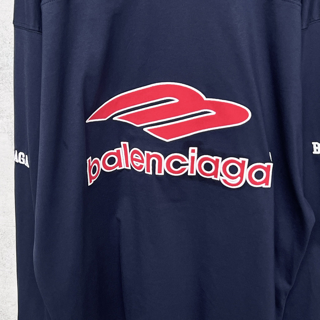 Balenciaga navy long-sleeve sweatshirt with large red-and-white Balenciaga logo