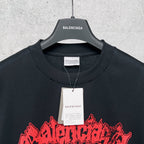 Graphic T-shirt collar and hang tag, black with red-and-blue artwork