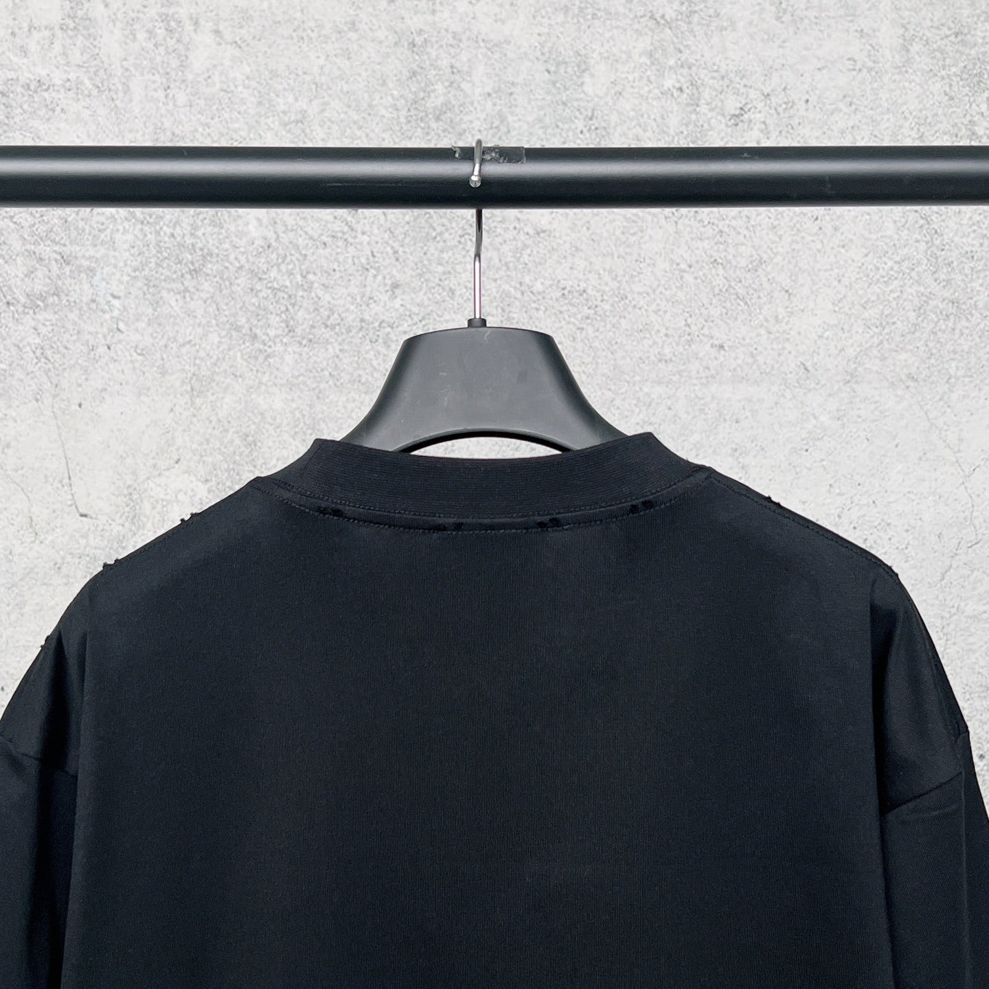 Graphic T-shirt back, black crewneck with no visible print