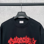 Graphic T-shirt with red title print, black base and crew neckline