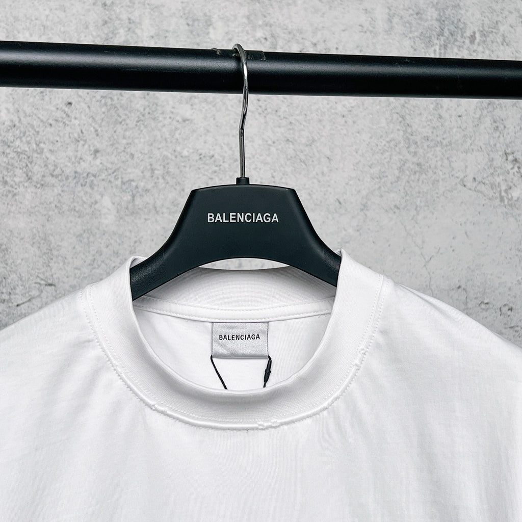 White T-shirt collar with attached hang tag on black hanger