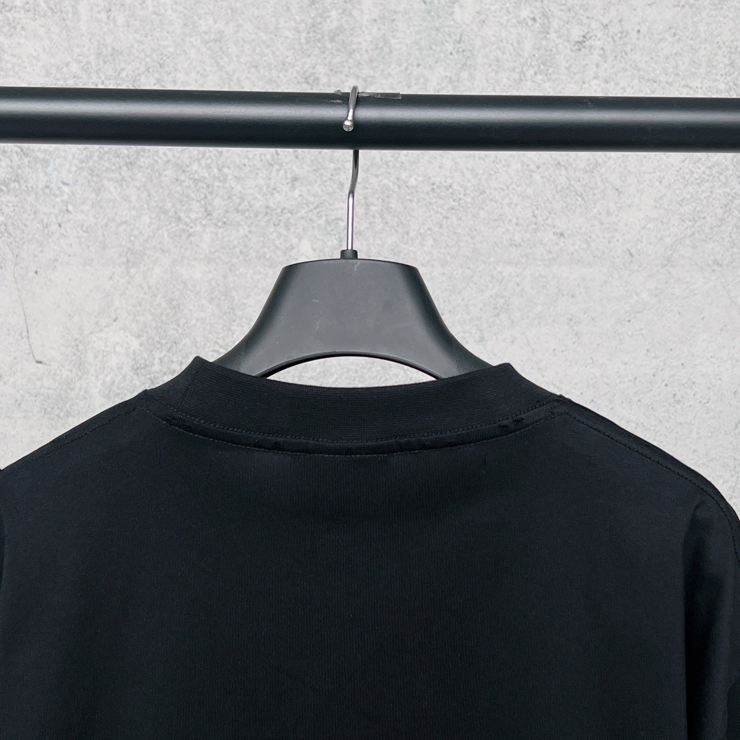 Black T-shirt back with crew neck and hanging tag