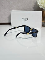 Celine blue-tinted sunglasses, black frame, gold hinge details