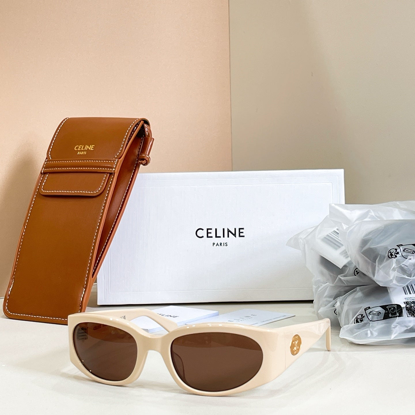 Celine glasses with cream frame and dark brown-tinted lenses