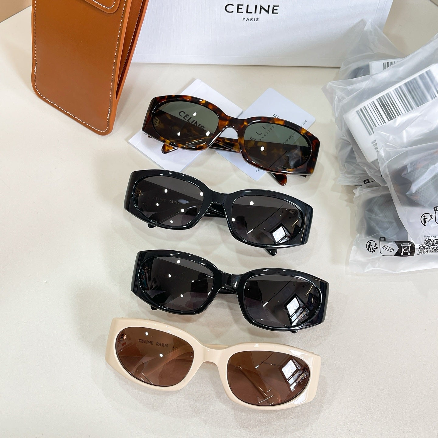Celine glasses set with three frames: tortoiseshell, black, and cream