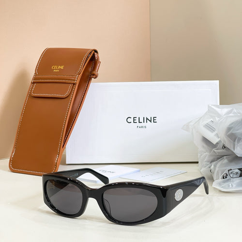 Black cat-eye sunglasses with dark lenses and gold logo detail at temple