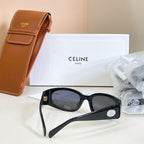 Black cat-eye sunglasses with dark lenses and gold emblem on side