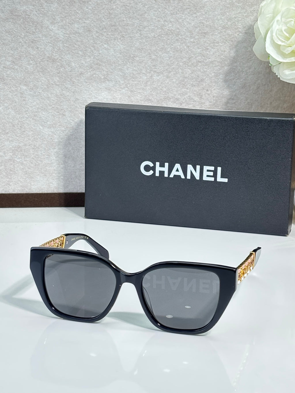 Chanel sunglasses with black frame and gray tinted lenses