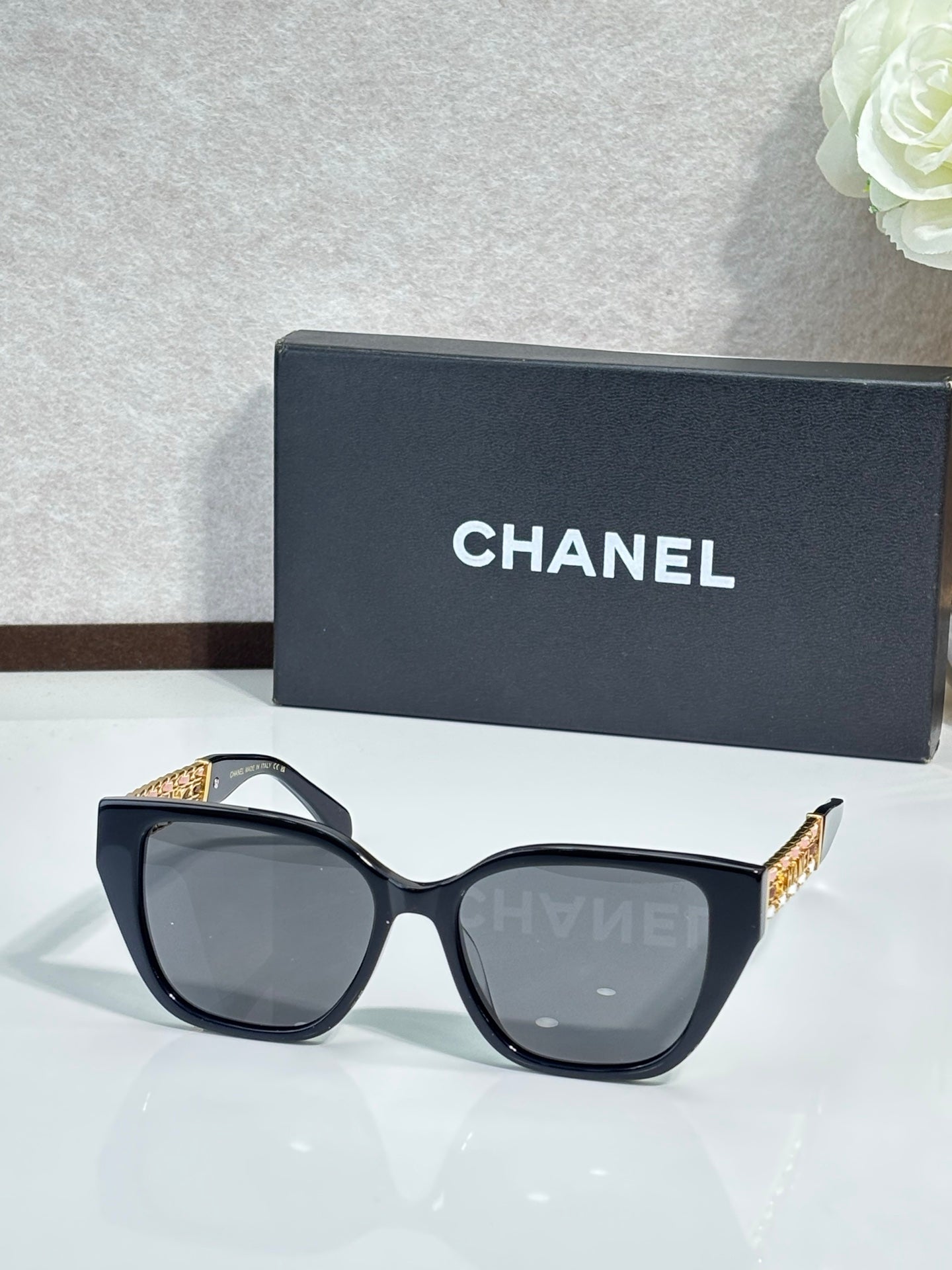 Chanel sunglasses with black frame and gray tinted lenses