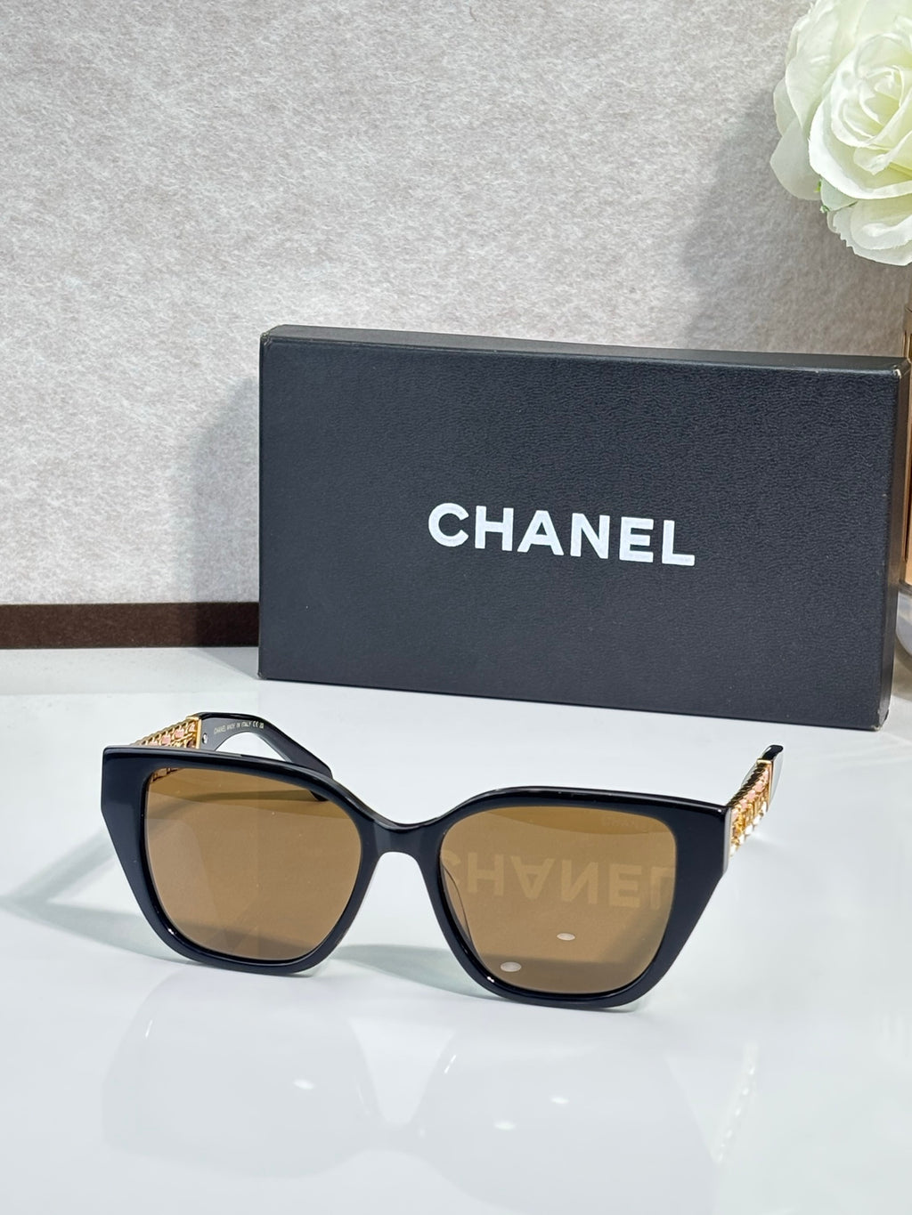 Chanel sunglasses with dark blue frame and brown tinted lenses