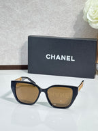 Chanel sunglasses with dark blue frame and brown tinted lenses