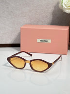 Tortoise-brown cat-eye sunglasses with amber lenses and gold-tone temple tips