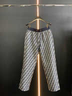 Dior pants in black with white FF-style pattern and elastic waistband, full view