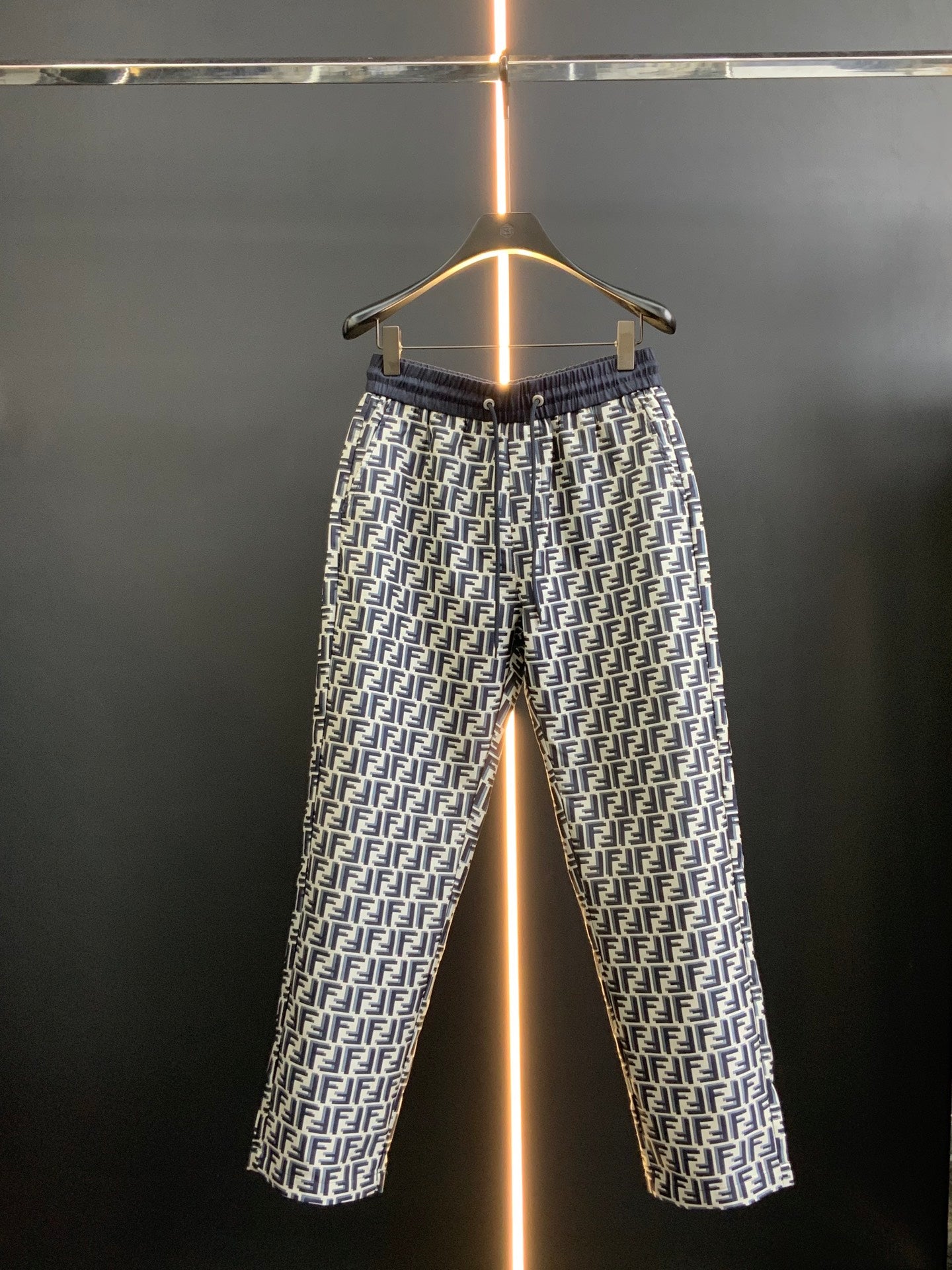 Dior pants in black with white FF-style pattern and elastic waistband, full view