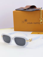 Louis Vuitton glasses, white frames with dark lenses and gold hinge accents