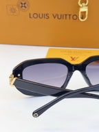 Louis Vuitton oversized sunglasses with dark frames and purple-tinted lenses