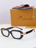 Louis Vuitton glasses with dark tortoiseshell frames and gold hinge detail