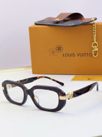 Louis Vuitton glasses with dark tortoiseshell frames and gold hinge detail